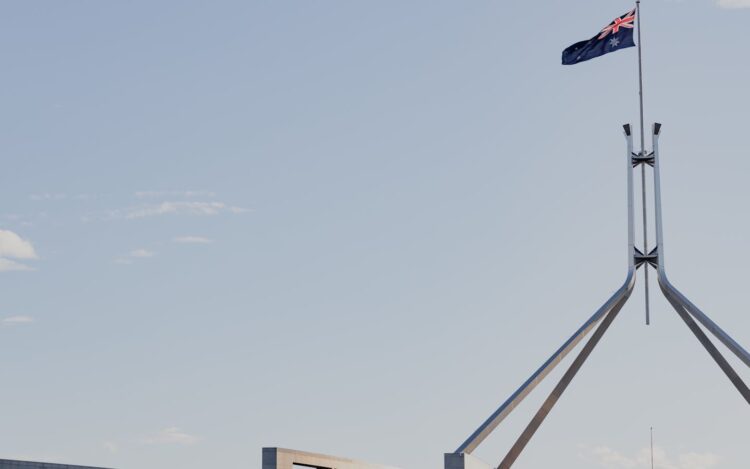 Australian flag flying over Parliament House in Canberra during the 2026 Federal Budget