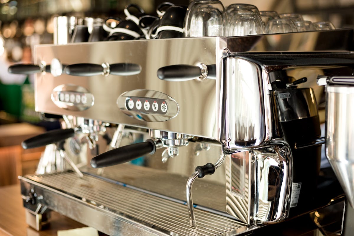 Commercial stainless steel espresso machine on a café counter — a typical asset eligible for the instant asset write-off