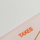 An envelope labelled TAXES — a Director Penalty Notice from the ATO can make a company tax debt your personal liability