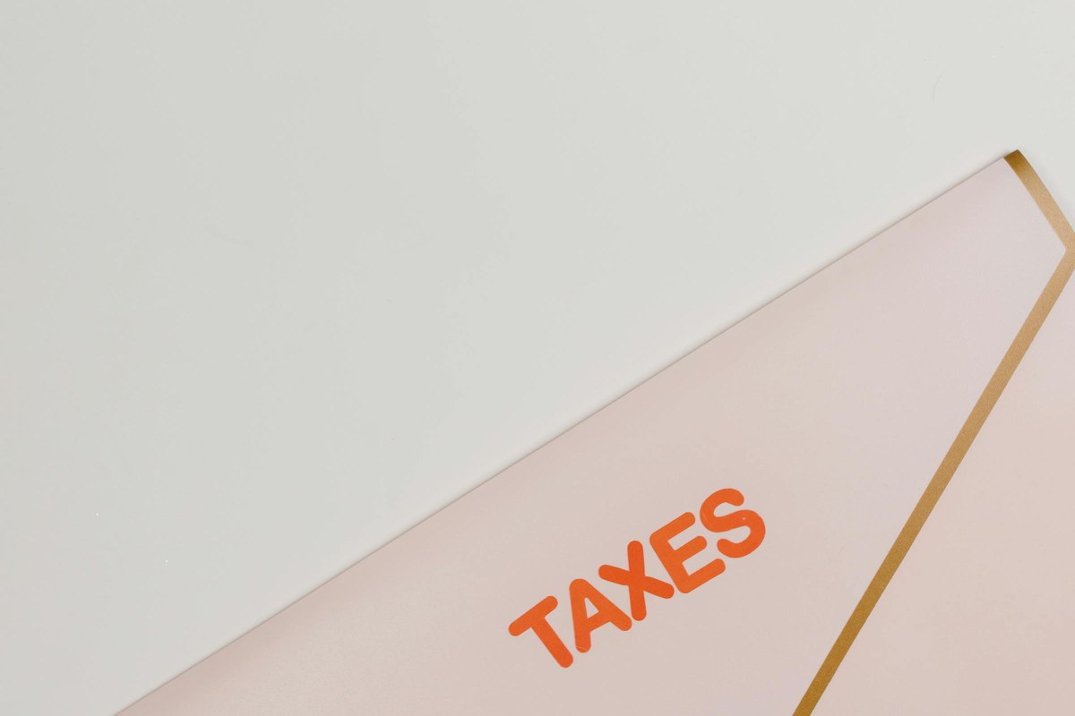 An envelope labelled TAXES — symbol of a Director Penalty Notice from the ATO that can make a company tax debt your personal liability