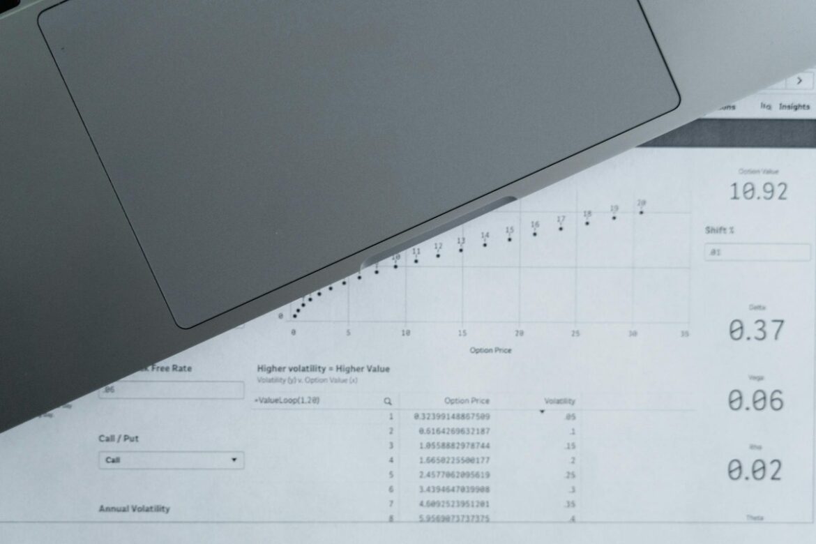 A laptop sitting on a spreadsheet of numbers — symbolising EOFY payroll finalisation and the Payday Super transition for Australian small business employers