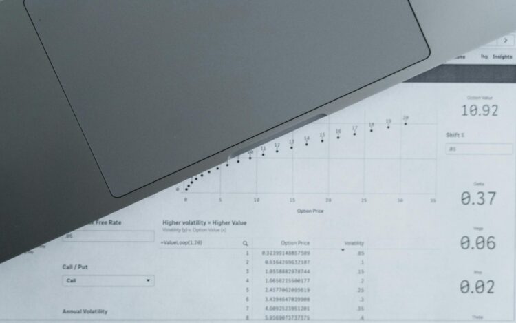 A laptop sitting on a spreadsheet of numbers — symbolising EOFY payroll finalisation and the Payday Super transition for Australian small business employers