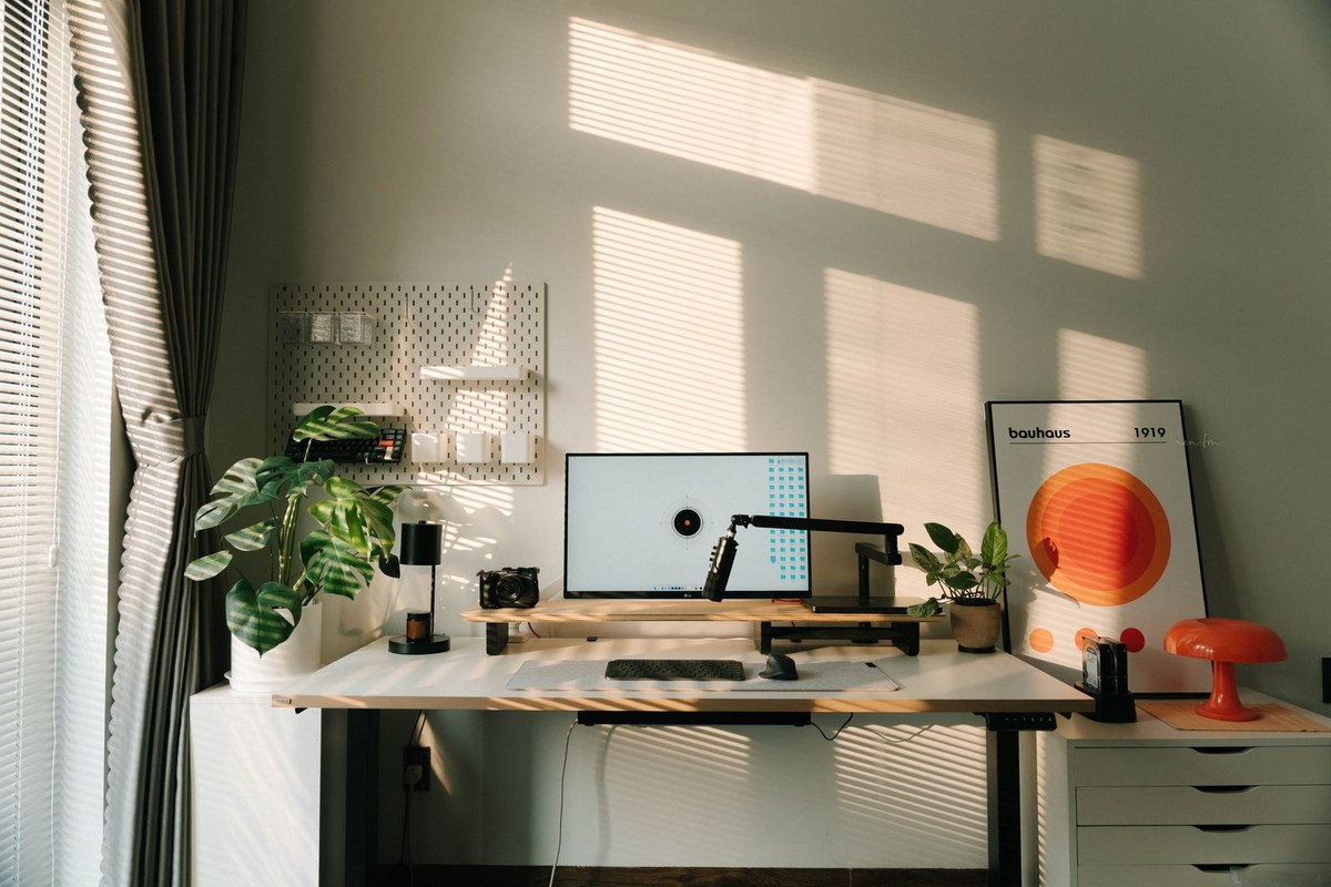 Home office desk with laptop, notebook and coffee, showing a working from home setup for a 2026 Australian tax deduction