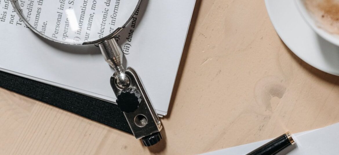 Reviewing tax documents with a magnifying glass to find commonly missed deductions