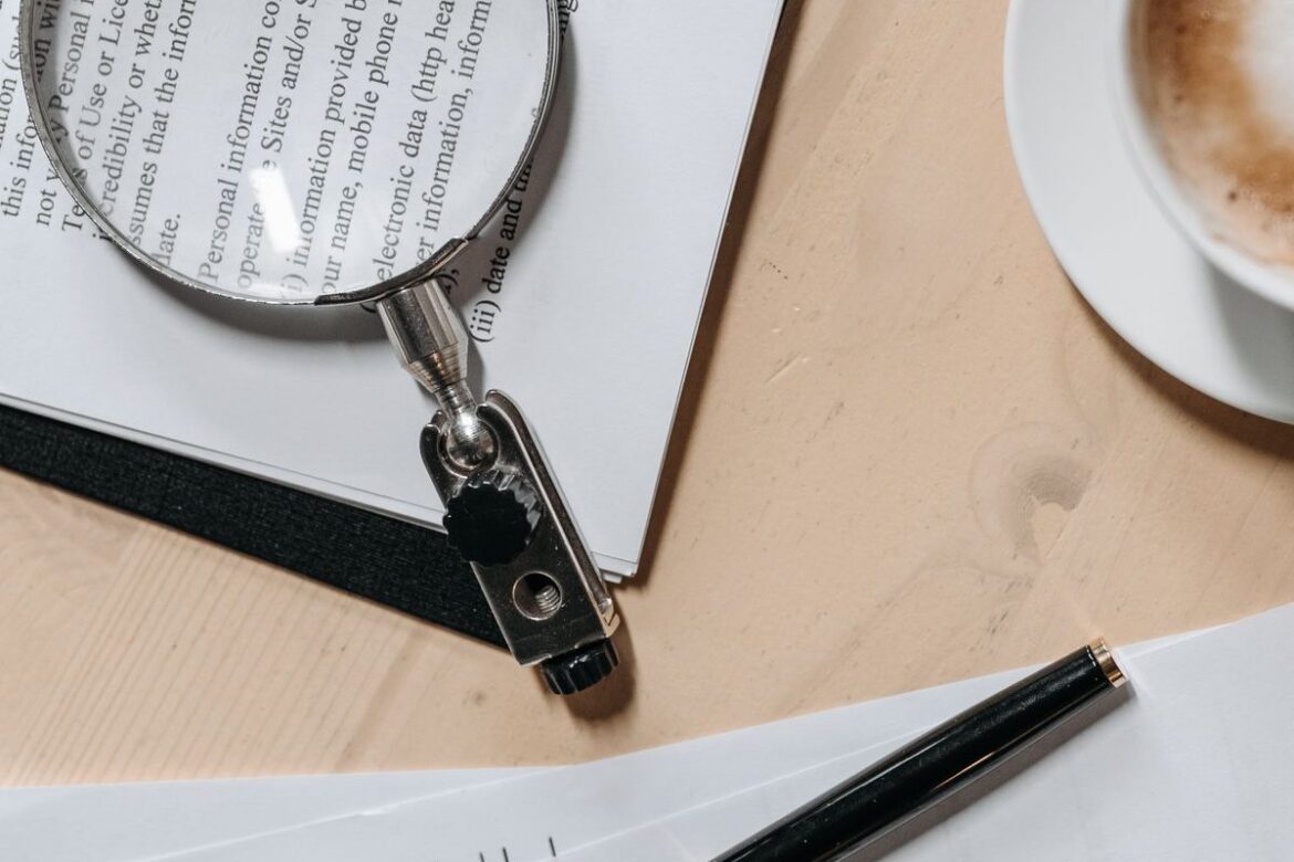 Reviewing tax documents with a magnifying glass to find commonly missed deductions