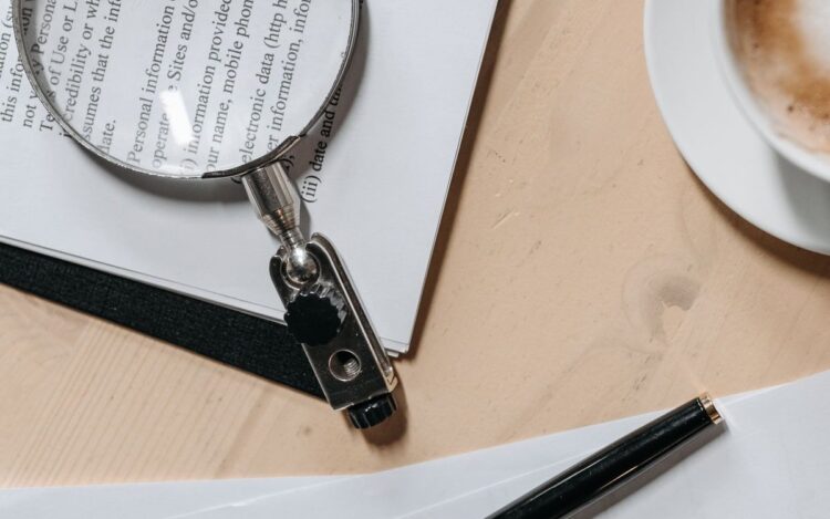 Reviewing tax documents with a magnifying glass to find commonly missed deductions