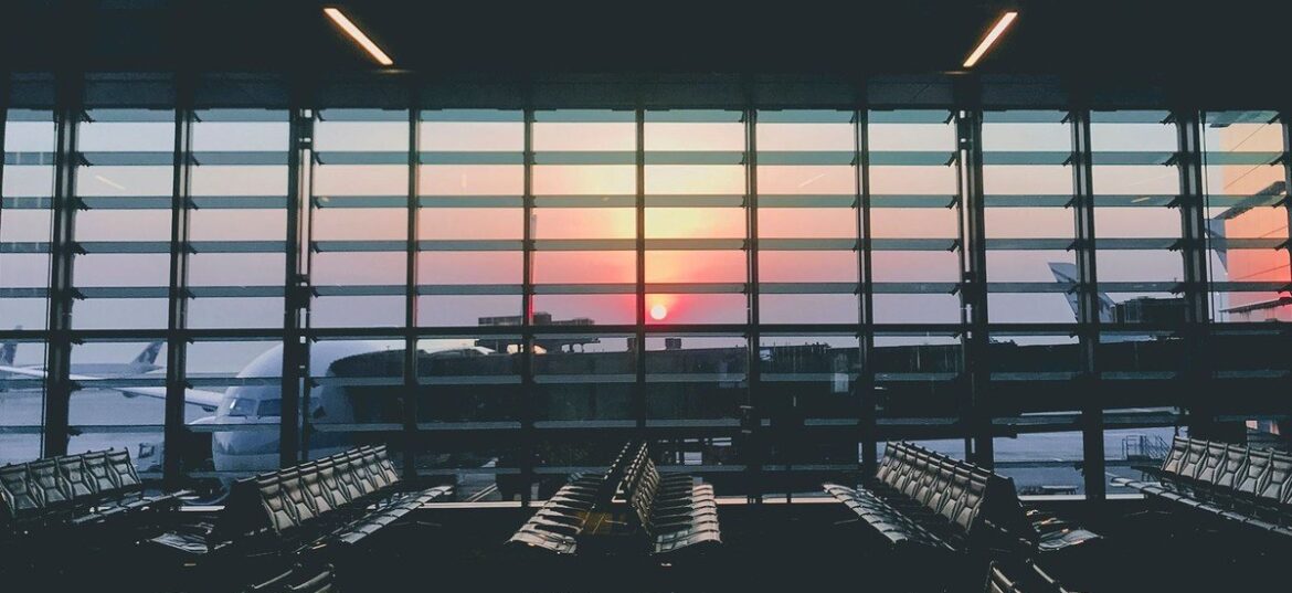 Empty airport departure lounge at sunset, Australian tax residency for people working overseas, Wiselink Accountants