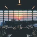 Empty airport departure lounge at sunset, Australian tax residency for people working overseas, Wiselink Accountants