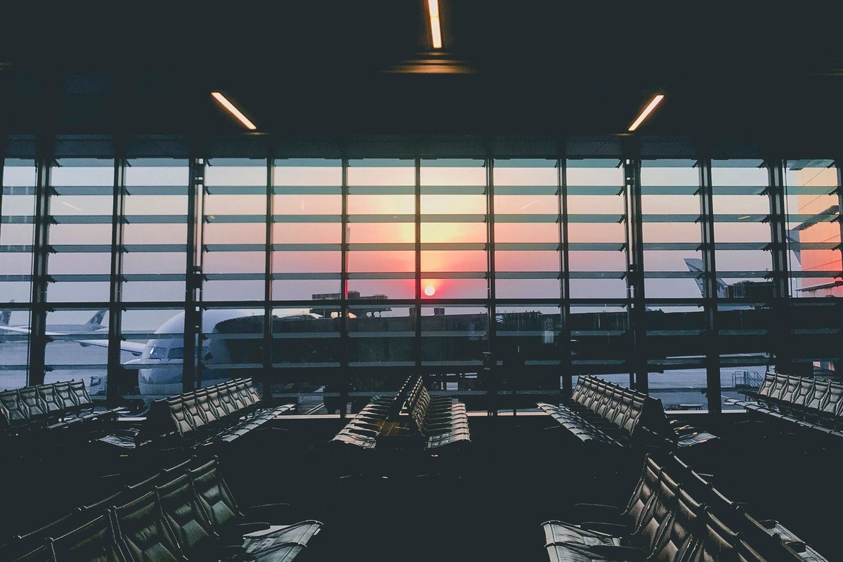 Empty airport departure lounge at sunset: working overseas does not end Australian tax residency on its own, Wiselink Accountants Melbourne and Brisbane